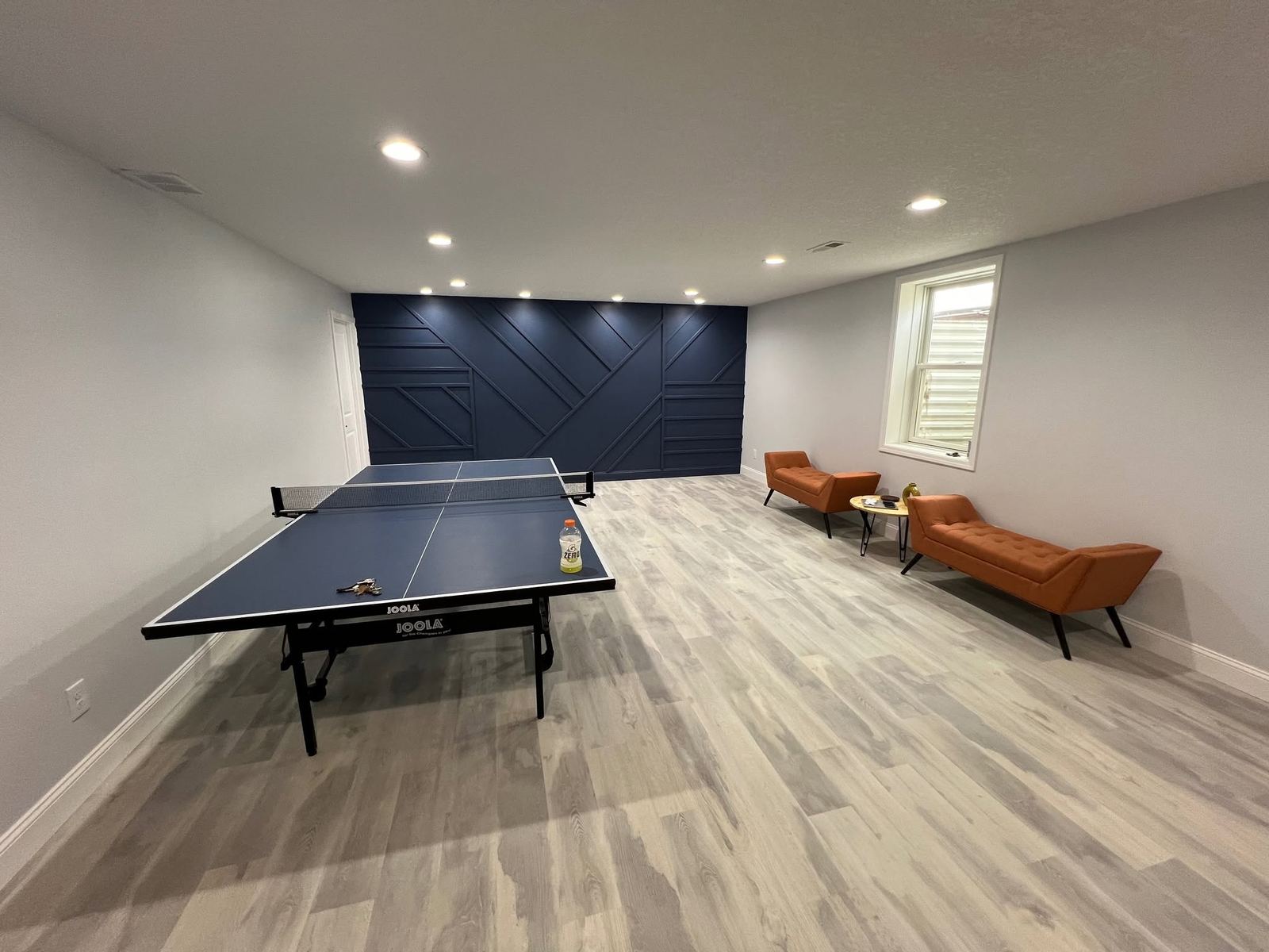 Basement game room ping pong accent wall Davenport IA