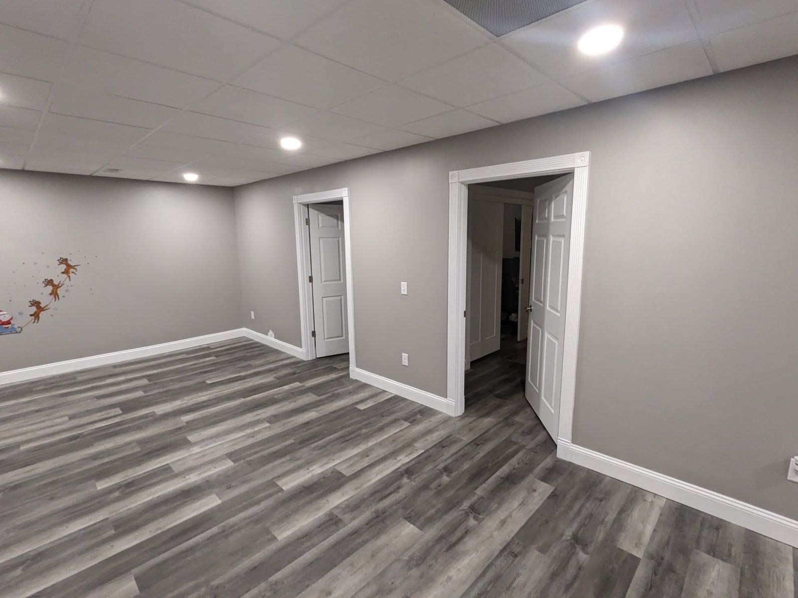 Finished basement room gray walls white trim Davenport IA